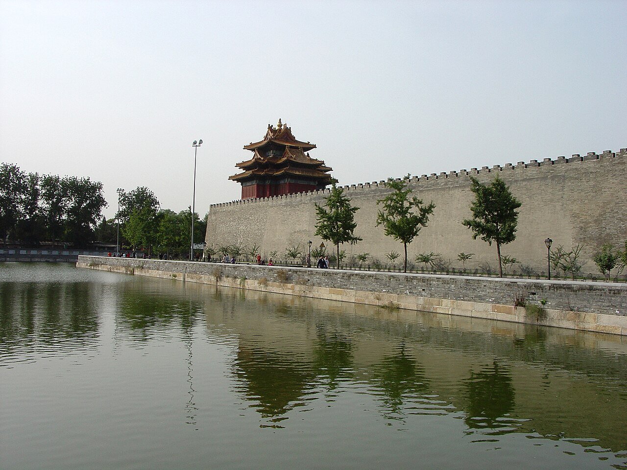 Corner tower of the Forbidden City beside the moat